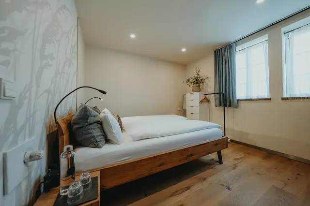 Queen bed room with meadow view — room at Biohotel WildLand, Wietze — photo 2 of 4
