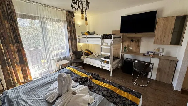 Family Room | Large balcony with garden view — Hotel Paidion, Braunlage (3/6)