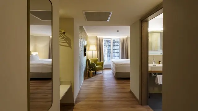 Family Room | Bedroom with Living area – Hotel zum Rappen Freiburg