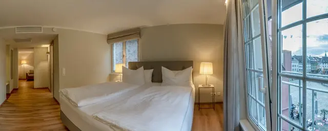 Family Room | Bedroom with Living area — room at Hotel zum Rappen Freiburg, Freiburg — photo 2 of 4