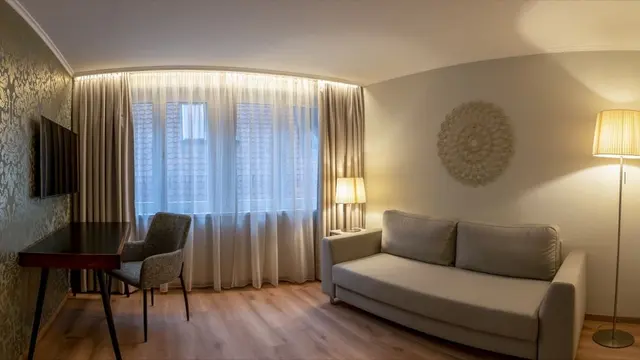 Family Room | Bedroom with Living area — room at Hotel zum Rappen Freiburg, Freiburg — photo 3 of 4