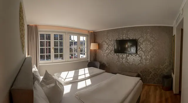 Small Deluxe | Double Bedroom & View to Cathedral — room at Hotel zum Rappen Freiburg, Freiburg — photo 2 of 6