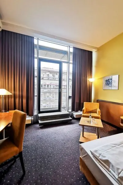Twin Beds | Classic | Floor to Ceiling Windows — room at Plaza Hotel & Living, Frankfurt Am Main — photo 2 of 2