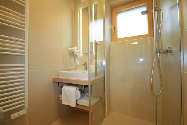 Sun Lodge | 2 bedroom panorama apartment with Loggia | twin beds | sofa bed | dog friendly | Indoor pool, garden, relax area, sauna & gym — apartment at Schladming Appartements Maria Gruber GmbH, Schladming — photo 12 of 25
