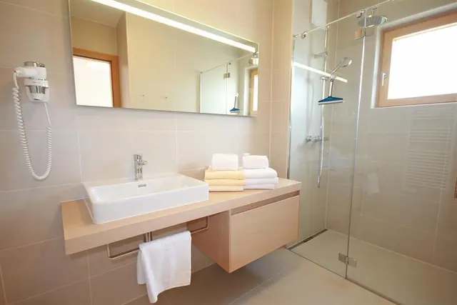 Sun Lodge | 2 bedroom panorma apartment for 7 person with large corner Loggia | sofa bed in bedroom | sofa bed | microwave | Indoor pool, garden, relax area, sauna & gym — apartment at Schladming Appartements Maria Gruber GmbH, Schladming — photo 15 of 30