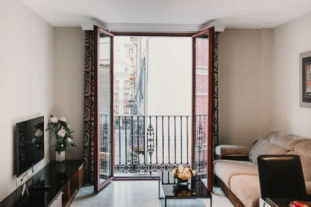 High Floor | Living Room and French Balcony — apartment at Signa Juristas, Valencia — photo 4 of 9